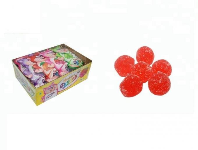 Forma della palla che mastica la frutta gommosa di colore rosso dei dolci condita imballata nella borsa del modello del gatto