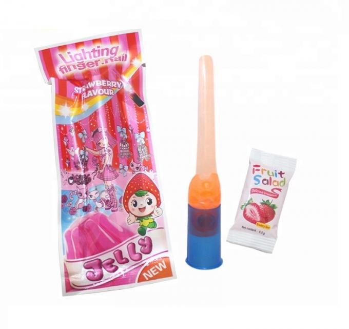 Il giocattolo dell'unghia del dito accende la gelatina di frutta variopinta di Candy per le feste di compleanno